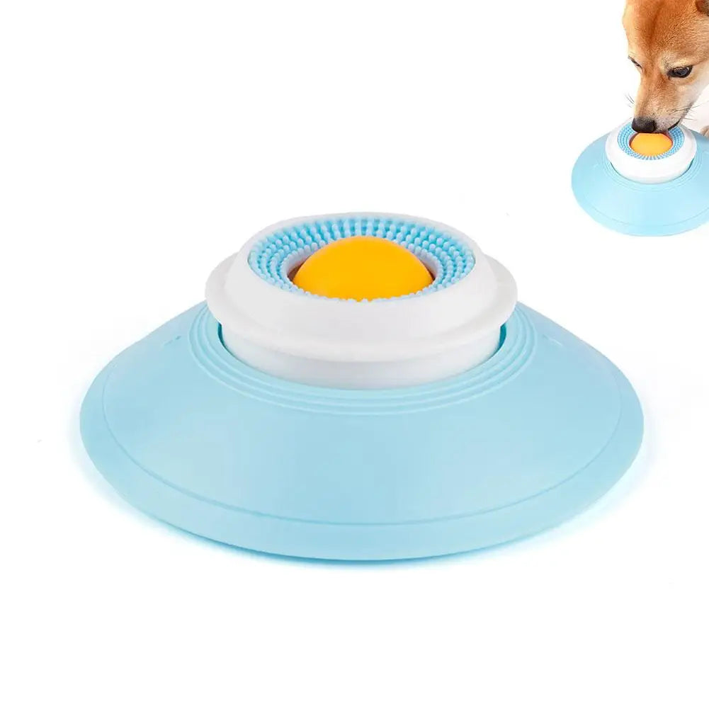 Le plateau de léchage avec la balle jaune